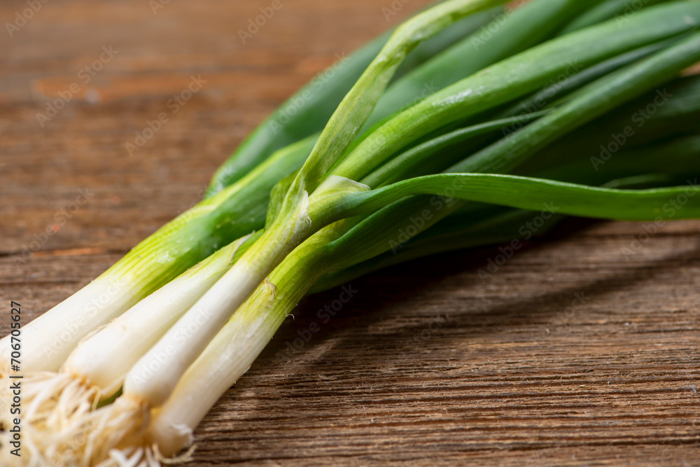 Fresh Green Onions on Wooden Cutting Board Fresh Green Onions on Wooden Cutting Board