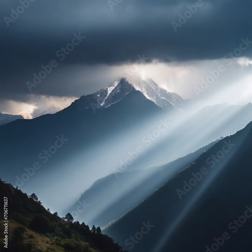 Sunlight breaking through the clouds with mountains in background