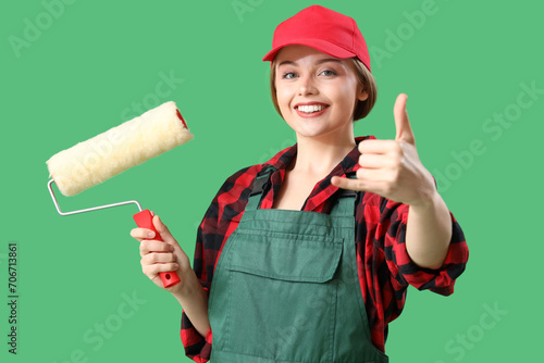 Female worker with paint ro...