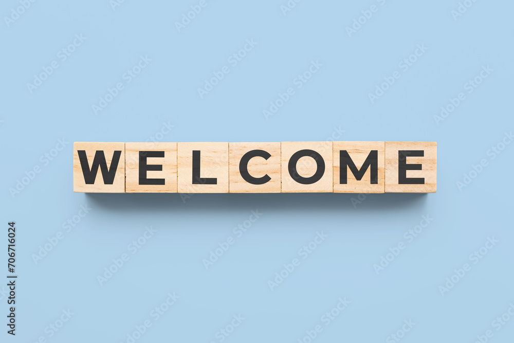 welcome wooden cubes on blue background welcome wooden cubes on blue background