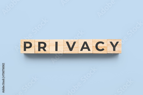 privacy wooden cubes on blue background