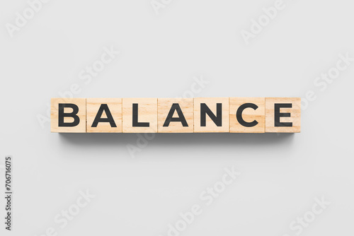 balance wooden cubes on white background photo