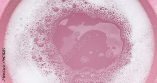 White detergent foam bubble  pink background.