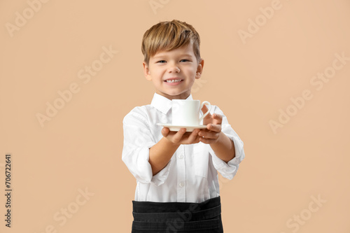 Cute little waiter with cof...