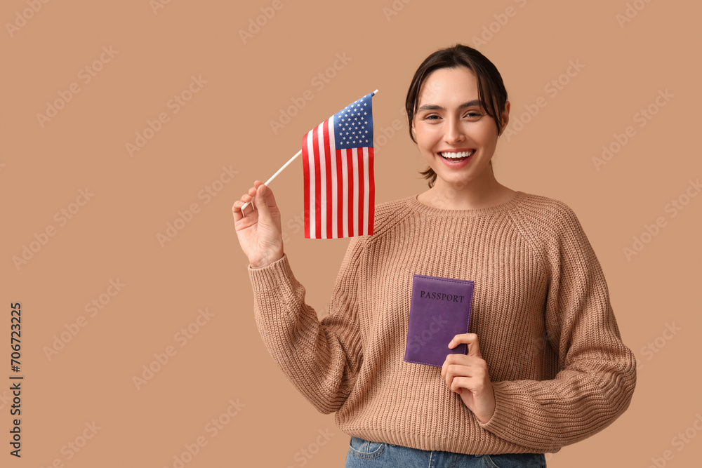 Pretty young woman with USA flag and passport on beige background. Immigration concept Pretty young woman with USA flag and passport on beige background. Immigration concept