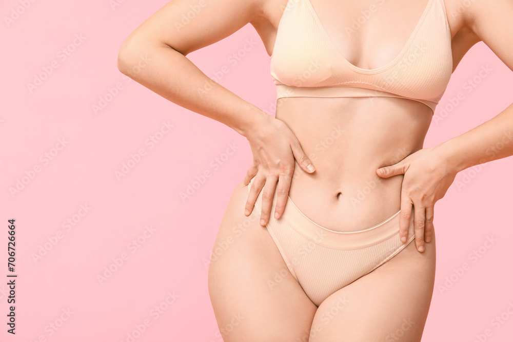 Body positive woman in underwear on pink background, closeup
