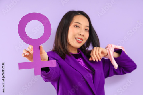Young Asian woman with gend...