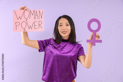 Young Asian girl holding pa...