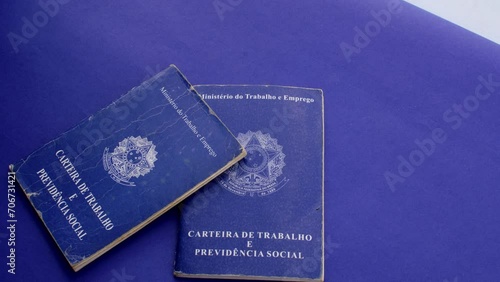 Brazilian work permit on blue surface: professional emblem in stark contrast with the blue background, representing the journey and value of work in Brazil. photo