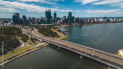 aerial view of Mitchell Freeway or Narrows Bridge in Perth. big bridge above swan river with a skyscraper cityscape in the background - Western Australia