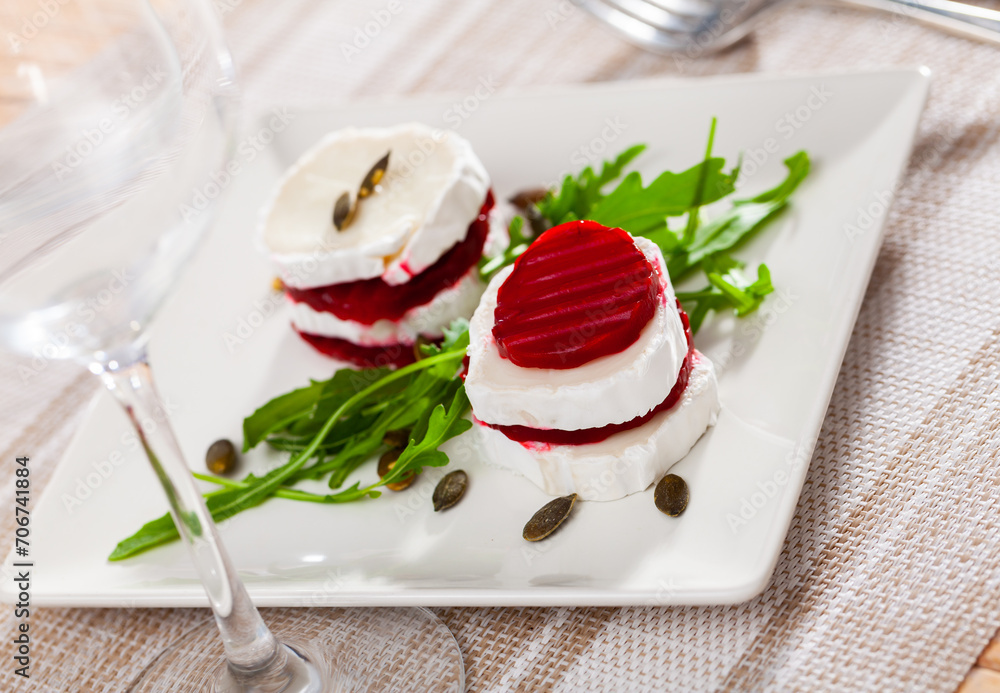 Healthy beetroot salad dish with fresh goat cheese