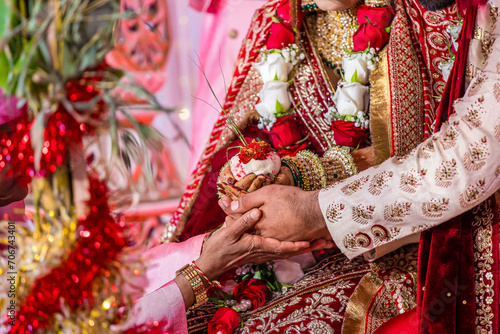 Indian Hindu wedding ceremony ritual items and hands close up