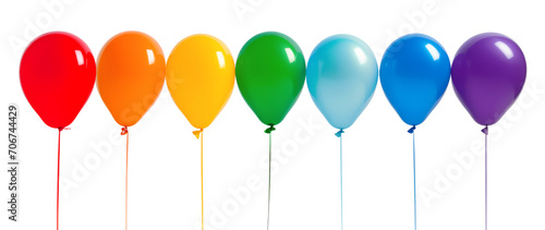 Line of helium balloons in rainbow colors on strings isolated on white background photo