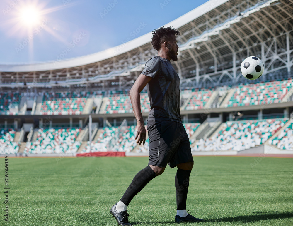 Professional football player in action at the stadium. The concept of sport, competition, movement, overcoming. The effect of the presence of the field.