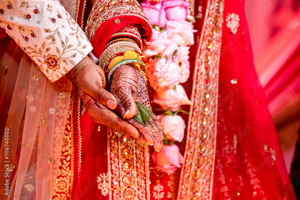 Indian Hindu wedding ceremony ritual items and hands close up