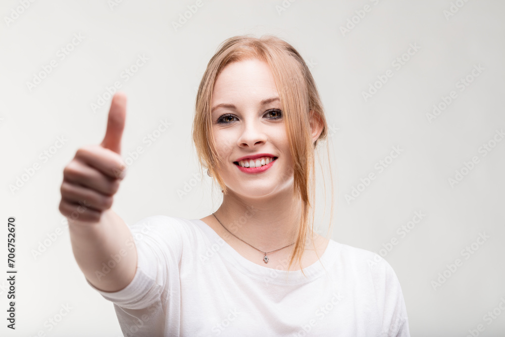 Positive gesture and smile radiate young woman's optimism Positive gesture and smile radiate young woman's optimism