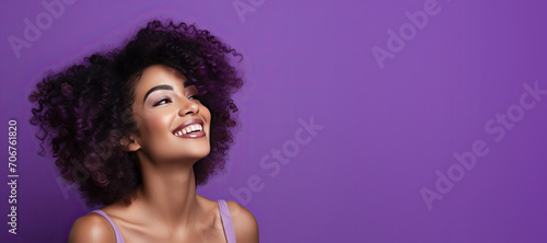 Happy Mature Black Woman on a Purple Background with Space for Copy