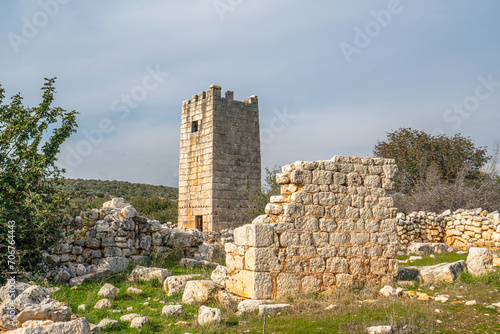 Amazing views of the Tower near  Kanlıdivane (ancient Canytelis), an ancient city situated around a big sinkhole in Mersin, Turkey. photo