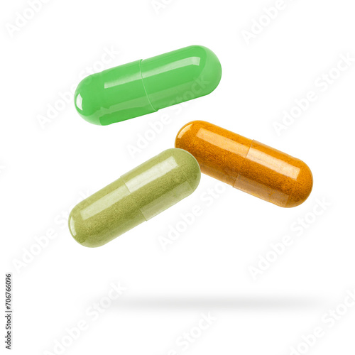 Close up. Capsule pills levitation isolated on white photo