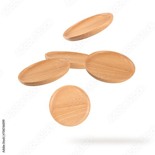 Falling wooden plate isolated on white background.