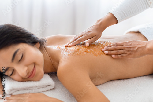 Satisfied woman with a therapeutic back exfoliation