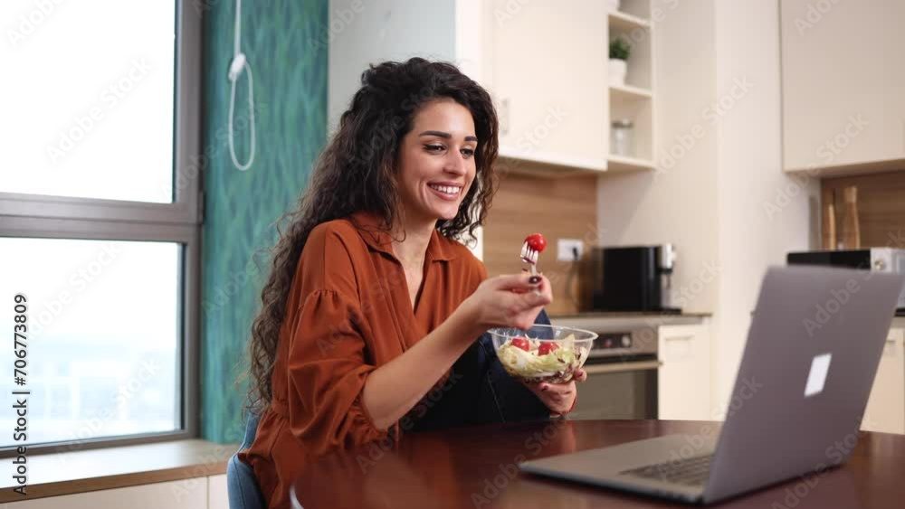 Woman having a breakfast while working from home Woman having a breakfast while working from home