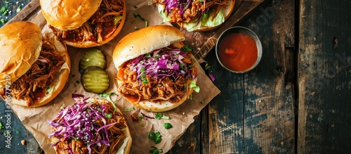 Pulled pork sandwiches with BBQ sauce cabbage and pickles overhead shot. with copy space image. Place for adding text or design photo