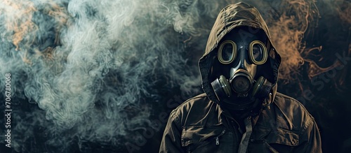 the man in anti gas mask in vapours of gas. with copy space image. Place for adding text or design photo