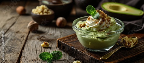 Raw avocado chocolate mousse topped with hazelnuts. with copy space image. Place for adding text or design