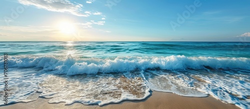 Tranquil shoreline with sunny blue sky over peaceful ocean waves. with copy space image. Place for adding text or design