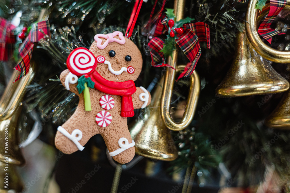 christmas decoration on a tree, cute ginger bread man hanging on the xmas tree