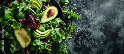 salad mix with avocado and cucumber with balsamic dressing. with copy space image. Place for adding text or design