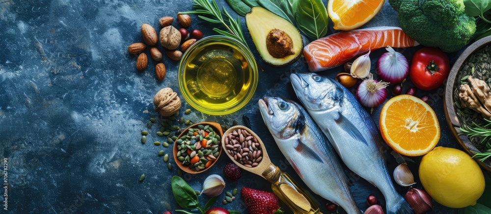 Overhead View of Fresh Omega 3 Rich Foods A variety of healthy foods like fish nuts seeds fruit vegetables and oil rich in omega 3 nutrients. with copy space image. Place for adding text or design