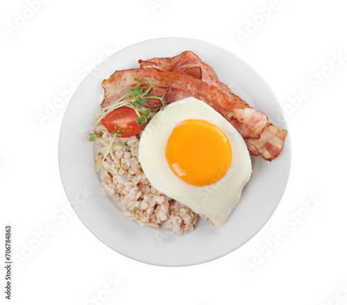 Tasty boiled oatmeal with fried egg, bacon and tomato isolated on white, top view