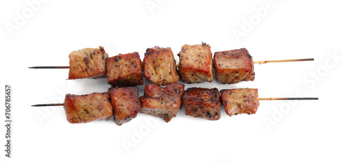 Skewers with delicious shish kebabs isolated on white, top view