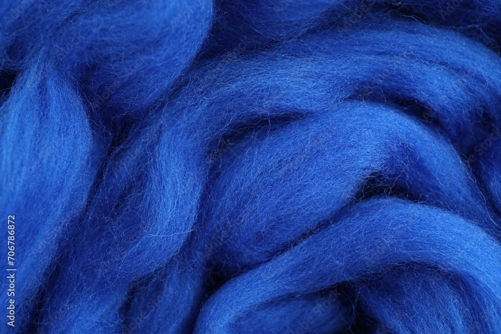 Blue felting wool as background, closeup view Blue felting wool as background, closeup view