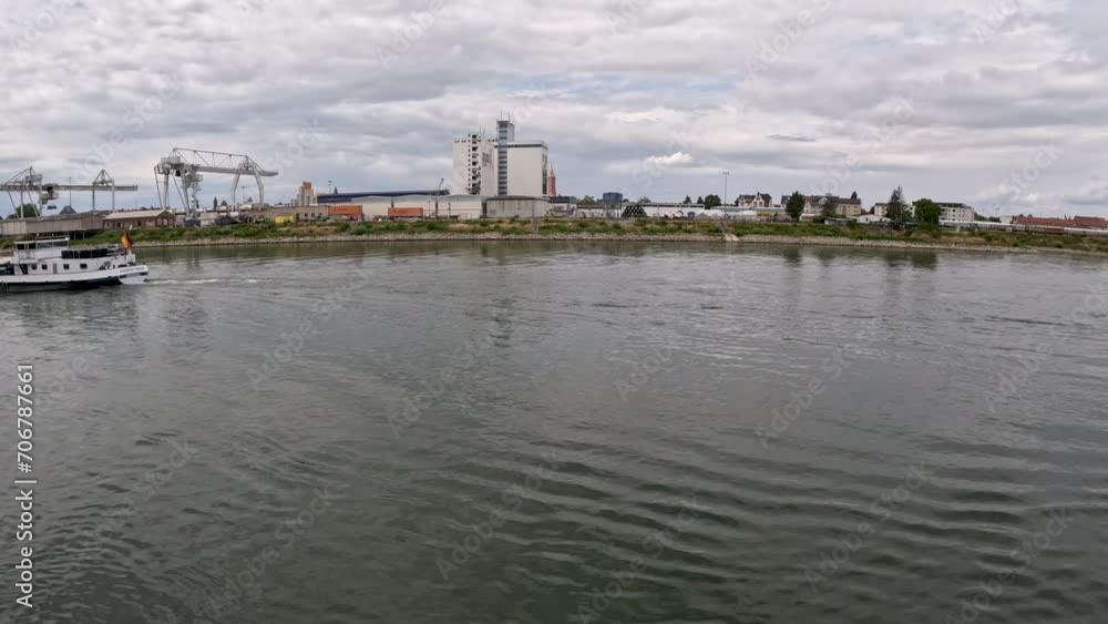 Industrial buildings and equipment on the Rhine River in Germany. Large silo towers in the center of view. Located just south of Mainz, Germany in Bleiau, Germany. Industrial buildings and equipment on the Rhine River in Germany. Large silo towers in the center of view. Located just south of Mainz, Germany in Bleiau, Germany.
