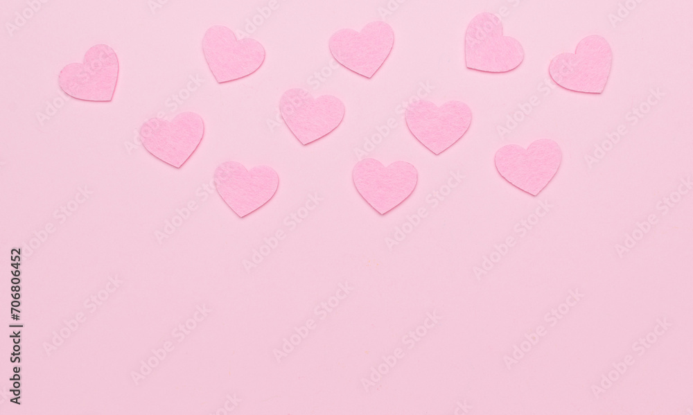 Light pink hearts on a light pink background.