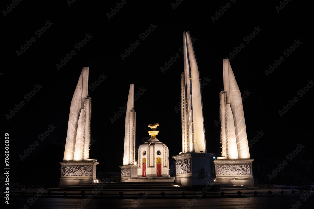 Democracy Monument, Bangkok, Thailand. Commemorating establishent of constitutional monarch in the country. Night view; monument is illuminated.
