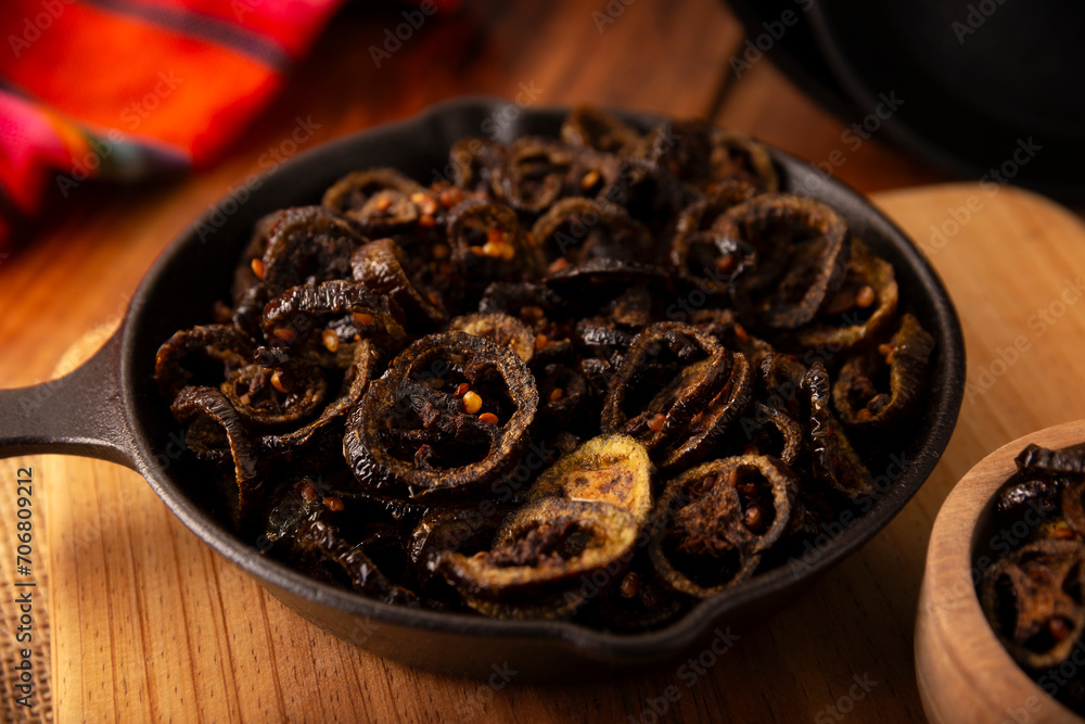 Chicharron de Chile. Crispy chili fried in olive oil with spices, easy homemade recipe from Mexico, ideal to accompany tacos, sandwiches, breakfast or any meal. Topview. Chicharron de Chile. Crispy chili fried in olive oil with spices, easy homemade recipe from Mexico, ideal to accompany tacos, sandwiches, breakfast or any meal. Topview.