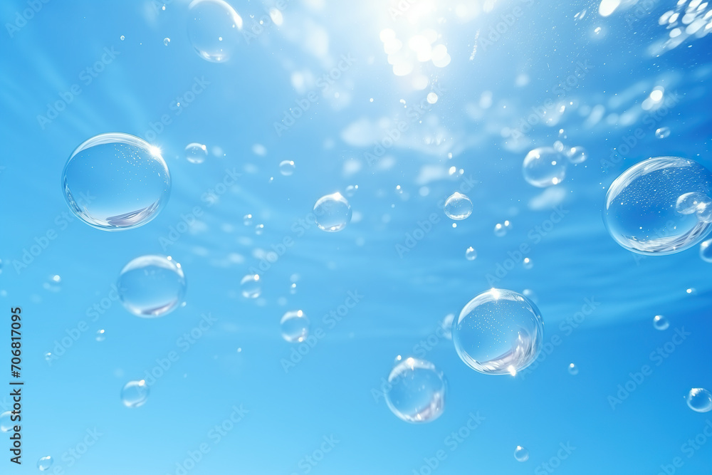 Transparent blue bubbles float on the blue water
