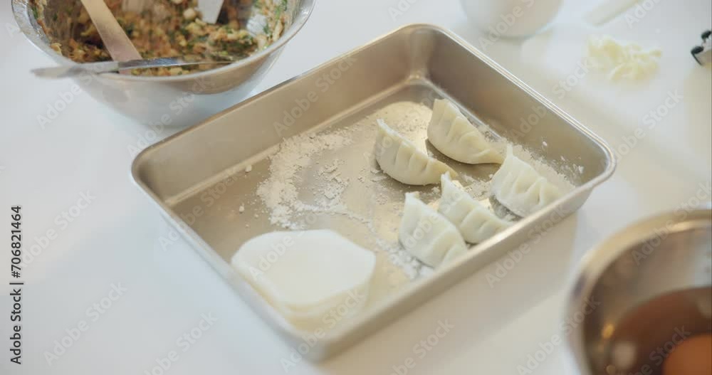 Dumpling, Japan and food on table in kitchen for process, meal preparation and traditional cuisine. Home, cooking and above of Japanese dish for lunch, dinner or supper for eating, diet and nutrition Dumpling, Japan and food on table in kitchen for process, meal preparation and traditional cuisine. Home, cooking and above of Japanese dish for lunch, dinner or supper for eating, diet and nutrition