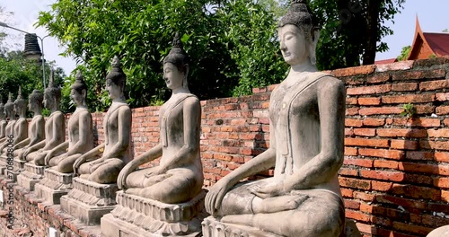 Row of buddha statues at Wat Yai Chaimongkol,Wat Yai Chai Mongkhon, Ayutthaya, Thailand photo