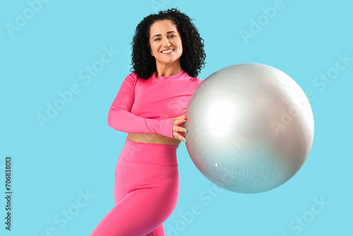 Sporty adult woman with fit...
