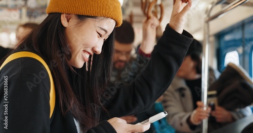 Foto Japan woman, happy and train on smartphone, social media and public transportation on metro bullet