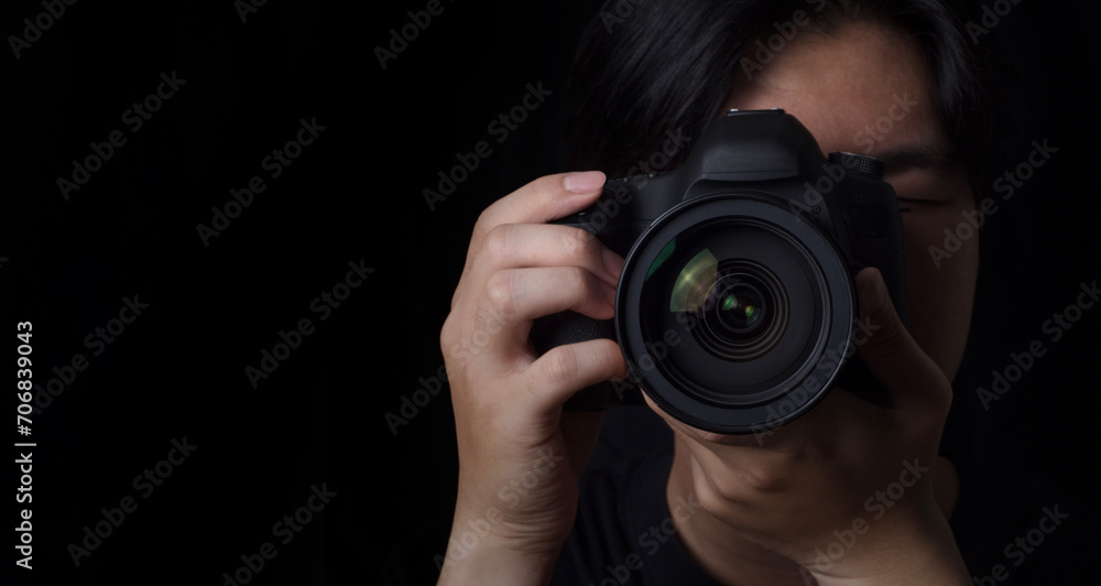 photographer take pictures Snapshot with camera. man hand holding with camera looking through lens.Concept for photographing articles Professionally. photographer take pictures Snapshot with camera. man hand holding with camera looking through lens.Concept for photographing articles Professionally.