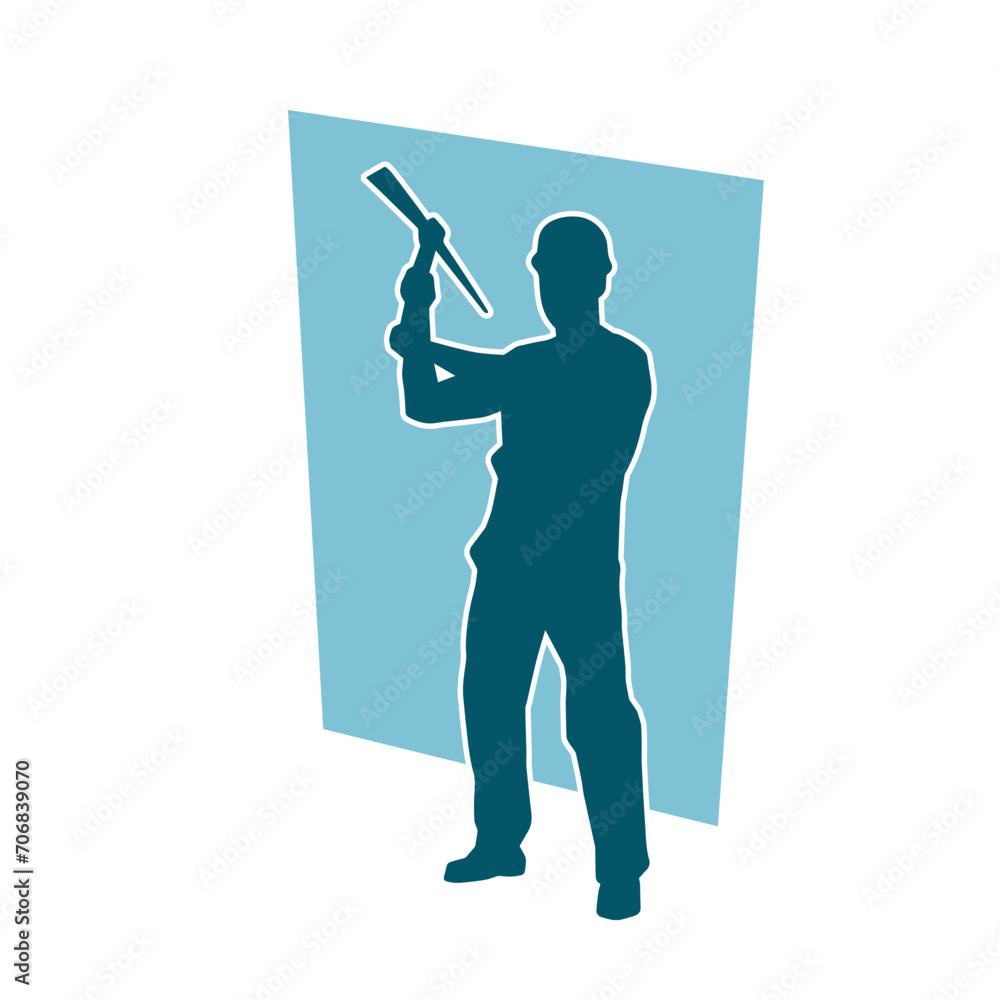 Silhouette of a man in worker costume carrying pick axe tool in action pose. Silhouette of a man in worker costume carrying pick axe tool in action pose.