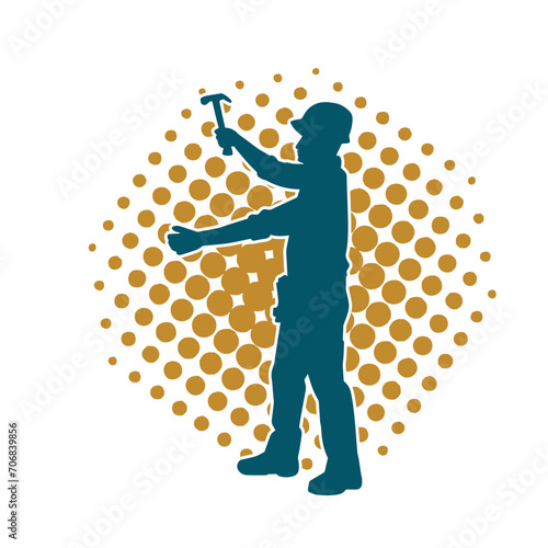 Silhouette of a worker carrying hammer tool. Silhouette of a worker in action pose using hammer tool.