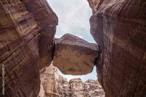 Photos A huge  stone fell and got stuck between rocks of gorge along the hiking route a