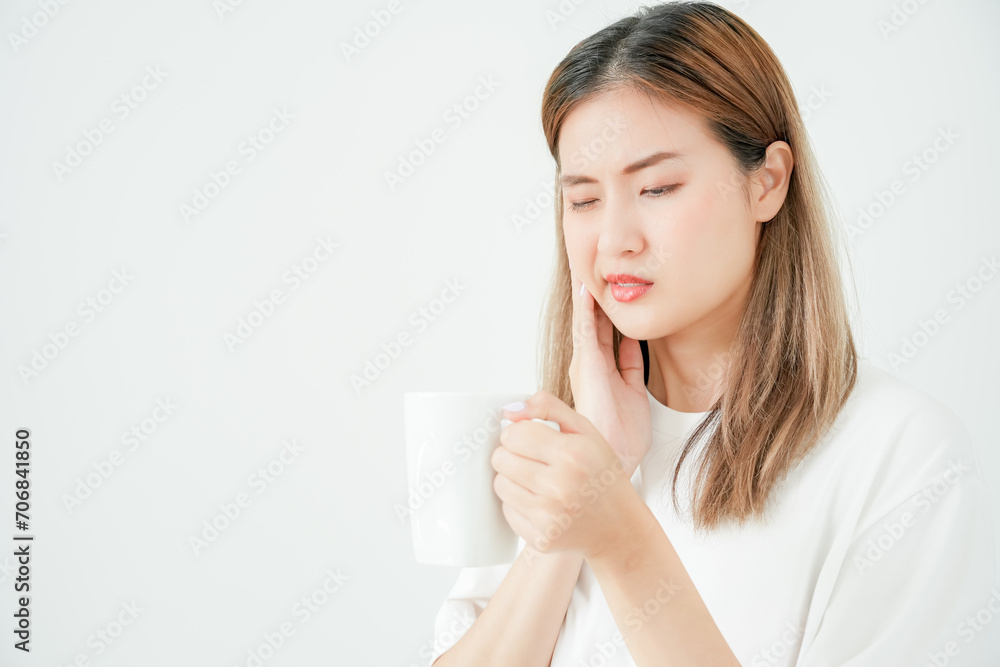 Asian woman feel sensitive teeth after drinking hot, female suffer tooth, decay problems, dental care, tooth extraction, decay problem, bad breath, Gingival Recession, Oral Hygiene instruction Asian woman feel sensitive teeth after drinking hot, female suffer tooth, decay problems, dental care, tooth extraction, decay problem, bad breath, Gingival Recession, Oral Hygiene instruction